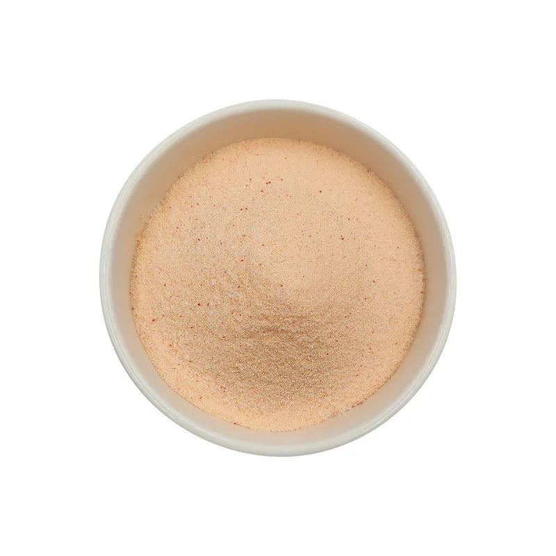 Poudre pêche fine beige clair dans bol blanc vue de dessus